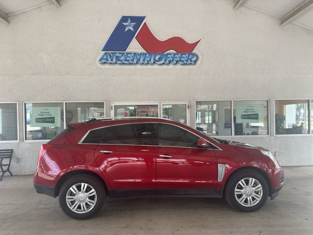 2015 Cadillac SRX Luxury in Crystal Red Tint — front three-quarter view